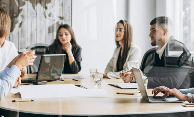 Group of people working out business plan in an office